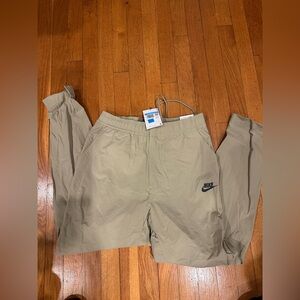 Nike Woven tan Tapered regular fit pant, new with tags size Medium $80 msrp